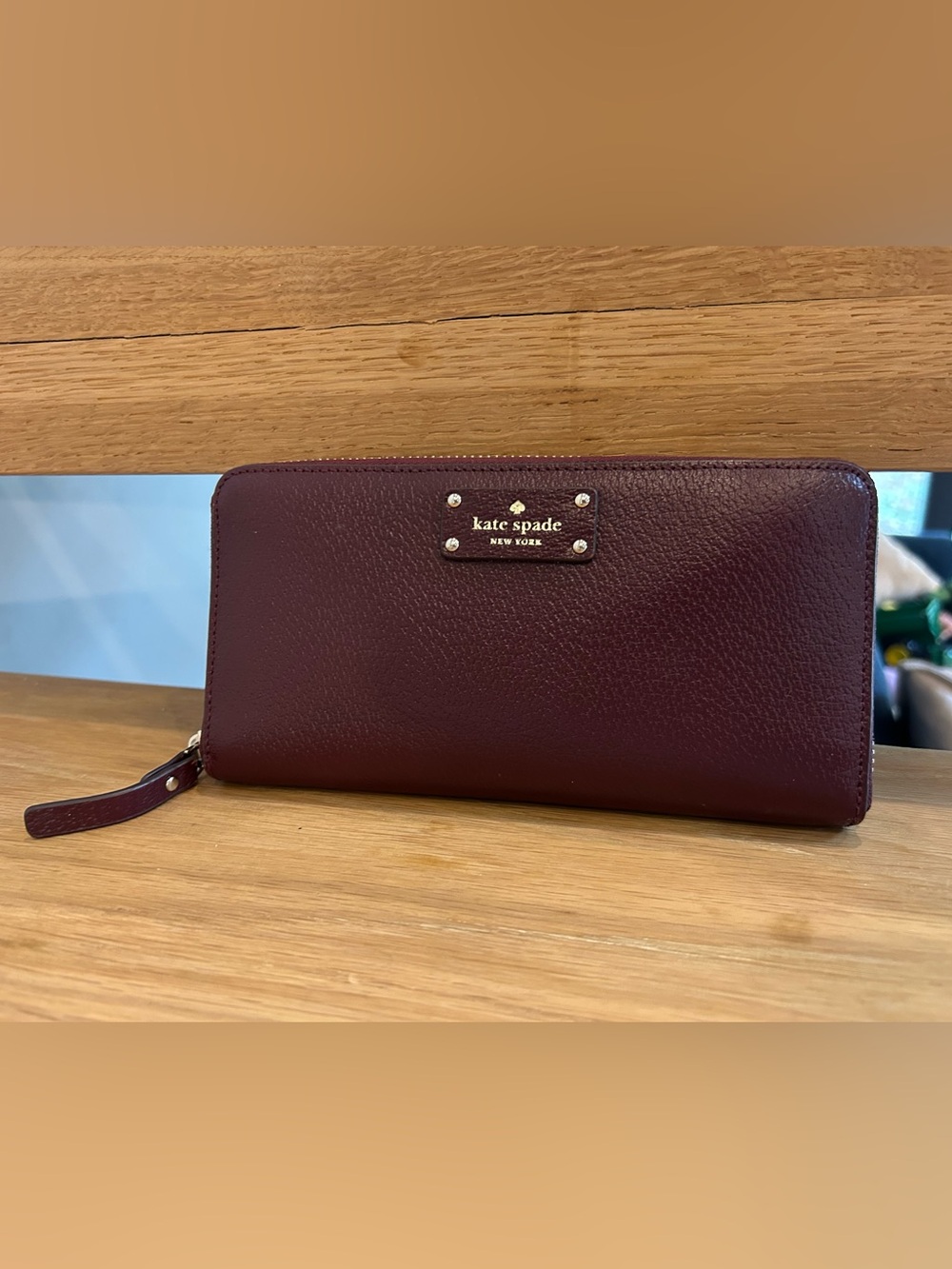 NWOT Kate Spade burgundy zip-around pebbled leather wallet